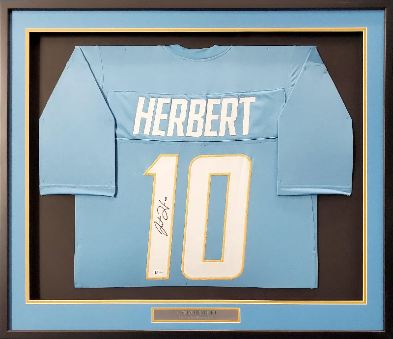 Autographed Football Helmet-Los Angeles Chargers Justin Herbert Autographed Framed Powder Blue Jersey Beckett BAS Stock #191176